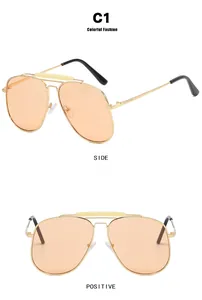 Detail view showing gold metal double bridge aviator sunglasses with orange lenses