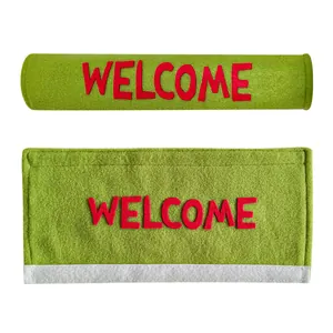 Green felt refrigerator handle covers with red Welcome text in flat and rolled views