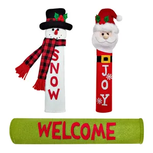 Detailed view of festive Christmas handle covers with Snowman and Santa Claus designs