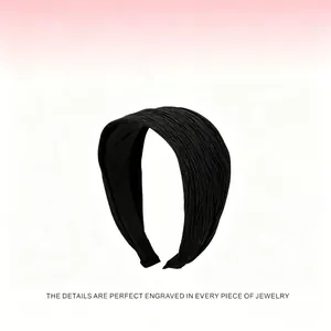Close-up showing the elegant pleated texture of this 7cm wide retro black headband.
