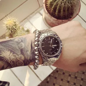 Men's silver titanium steel beaded bracelet with large round metal beads for daily wear.