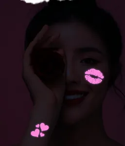 Fluorescent heart and lip shape glow-in-the-dark tattoo stickers on model face