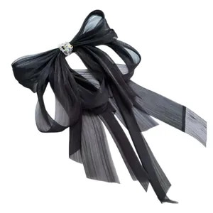 Fermaglio per capelli a fiocco in chiffon nero con cristallo e lunghi nastri