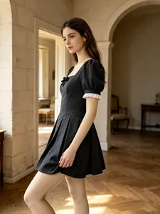 Elegant French vintage black dress with square neck and puff sleeves in retro interior