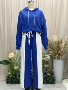 Full view of a blue and white color-block tracksuit set with a hoodie and wide-leg pants.