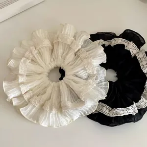 Coppia di elastici per capelli a pieghe stile francese con pizzo in bianco e nero.