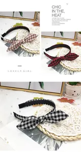 Close-up showing various colors of plaid bunny ear headbands with soft fabric texture