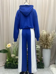 Back view of the blue and white contrast sports tracksuit featuring a hoodie and wide-leg pants