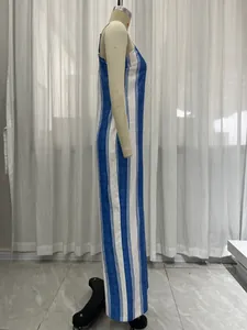 Side profile detail of blue and white striped sleeveless jumpsuit for elegant summer wear.