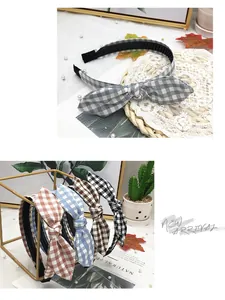 Detail view of cute plaid bunny ear headbands in various colors for hair styling.