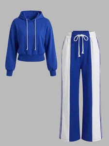Blue and white contrast two-piece sports set with a hooded sweatshirt and wide-leg pants.