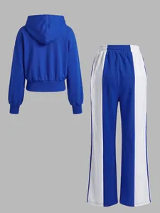 Back view of retro blue and white color block hoodie and wide-leg tracksuit set