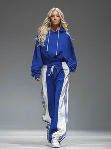 Two-piece blue and white tracksuit with cropped hoodie and striped wide-leg pants