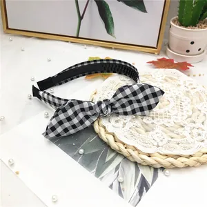 Cute black and white checkered rabbit ear headband with wide fabric design