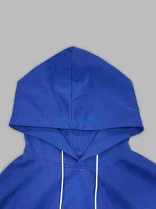 Detailed macro view showing the texture and hood design of a retro blue sports hoodie