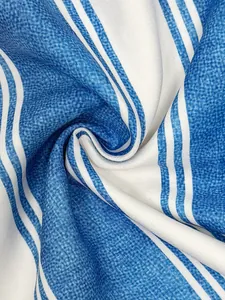 Close-up detail of blue and white striped fabric texture for summer jumpsuit