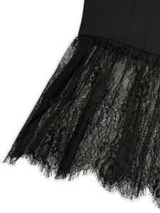 Detailed macro shot showcasing the intricate black eyelash lace hem on a chic sleeveless top