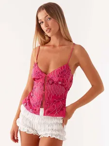 Fashionable pink sequined camisole with deep V-neck and tie-front detail for women