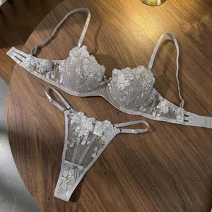 Detail view of sheer lace lingerie set with elegant rose flower embroidery