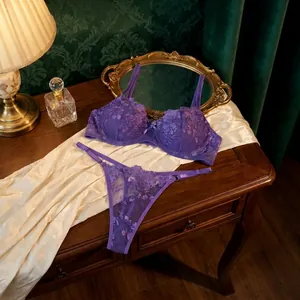 Detailed view of elegant purple lingerie set featuring intricate rose lace embroidery