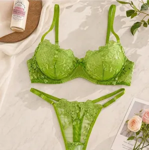 Detailed view of lime green sexy lingerie set featuring floral embroidery and sheer mesh lace.