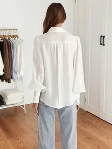 Detail showing the back of elegant lace collar blouse with lantern sleeves and smocked cuffs