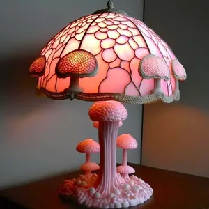 Glas-in-lood paddenstoel tafellamp met roze gloeiende kap voor een sfeervol decor