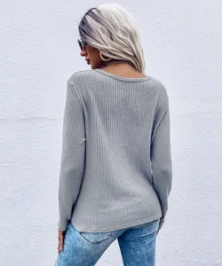 Women's casual grey waffle knit long sleeve top showing back texture and fit detail.