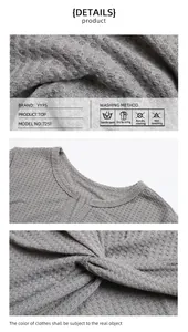 Detailed macro shots of grey waffle knit top fabric texture and twisted hem