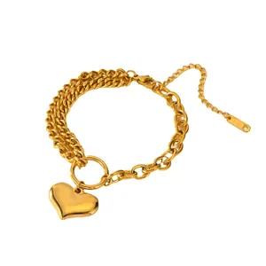 Elegant golden stainless steel bracelet featuring a polished heart pendant charm for women