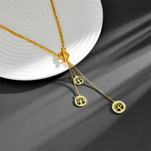 Detailed macro view of golden stainless steel tree of life necklace with crystals.