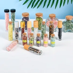 Collection of natural crystal gemstones in varied mini glass bottles for home decor