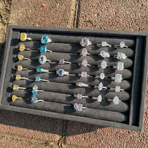 Assorted S925 silver rings with colorful ice-cut cubic zirconia in a display tray