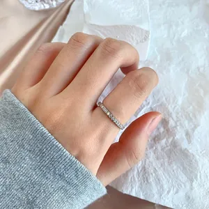 Detailed view of a sparkling S925 sterling silver stackable ring worn on a hand