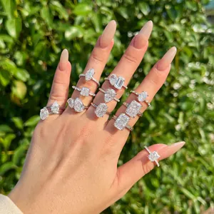 Detailed view of hand wearing various S925 silver rings with ice flower cut 8A zircons.
