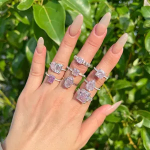 Detailed view of multiple S925 silver rings with sparkling pink ice-cut cubic zirconia