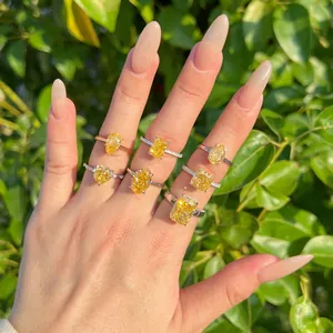 Macro view of multiple S925 silver rings with radiant yellow ice-cut cubic zirconia
