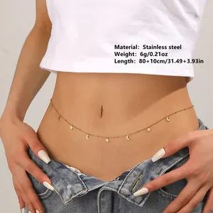 Detail view of a gold stainless steel waist chain with star and moon charms on a model.
