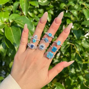 Close-up of multiple blue zircon S925 sterling silver rings with ice flower cut