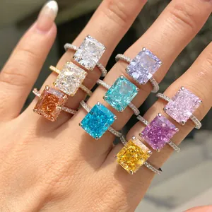 Close-up of S925 sterling silver rings with vibrant colored rectangular gemstones.