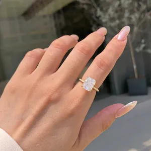 Close-up of radiant-cut sparkling zircon ring on hand for wedding