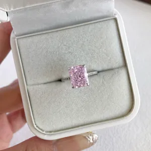Close-up detail of a sparkling pink radiant-cut zircon ring set in S925 silver box