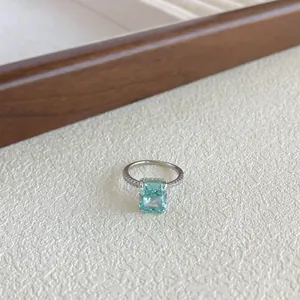 Elegant S925 sterling silver ring featuring a rectangular sea-blue zircon on a white background.
