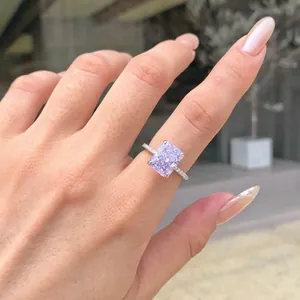 Close-up of elegant S925 silver ring with a square lavender gemstone on hand.