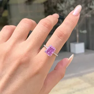 Close-up view of a radiant cut pink gemstone ring set in shimmering S925 sterling silver.