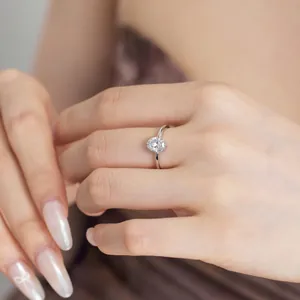 Detailed view of S925 sterling silver ring with waterdrop ice flower cut zircon on finger