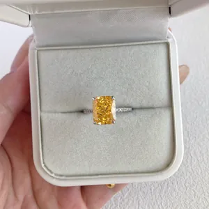Detailed macro view of a stunning cushion-cut yellow zircon ring inside a white velvet box