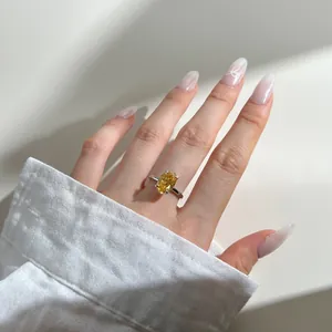 Close-up of a S925 sterling silver ring featuring a large oval yellow ice-cut zircon