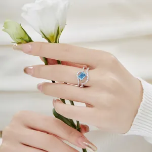 Close-up of elegant S925 sterling silver ring featuring a blue ice-flower cut zircon
