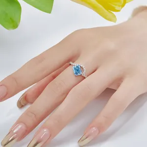 Elegant close-up of S925 sterling silver ring featuring a radiant ice blue gemstone